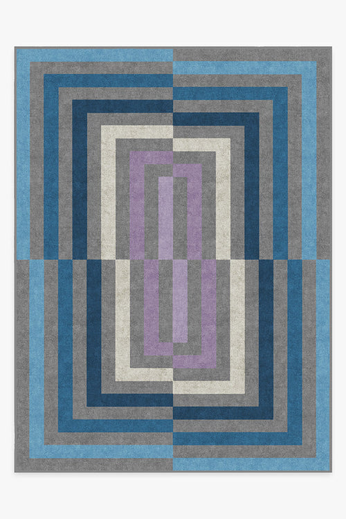 Geometric patterned rug with blue, gray, and purple colors on a white background