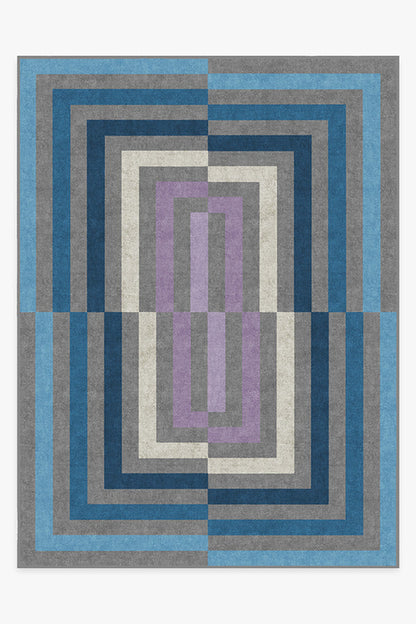 Geometric patterned rug with blue, gray, and purple colors on a white background