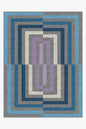 Geometric patterned rug with blue, gray, and purple colors on a white background