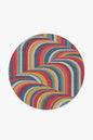 Round rug with colorful zigzag pattern on a white background