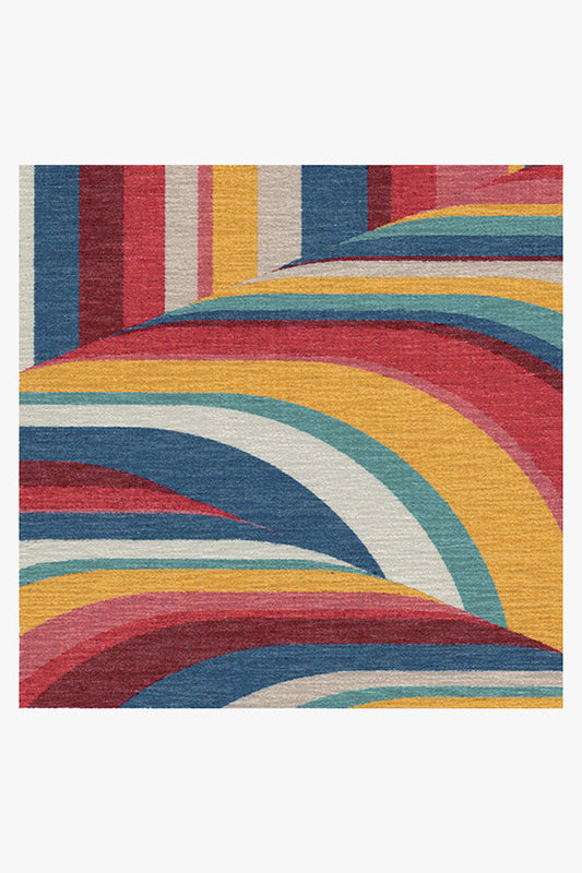 Multicolored abstract patterned rug on a white background