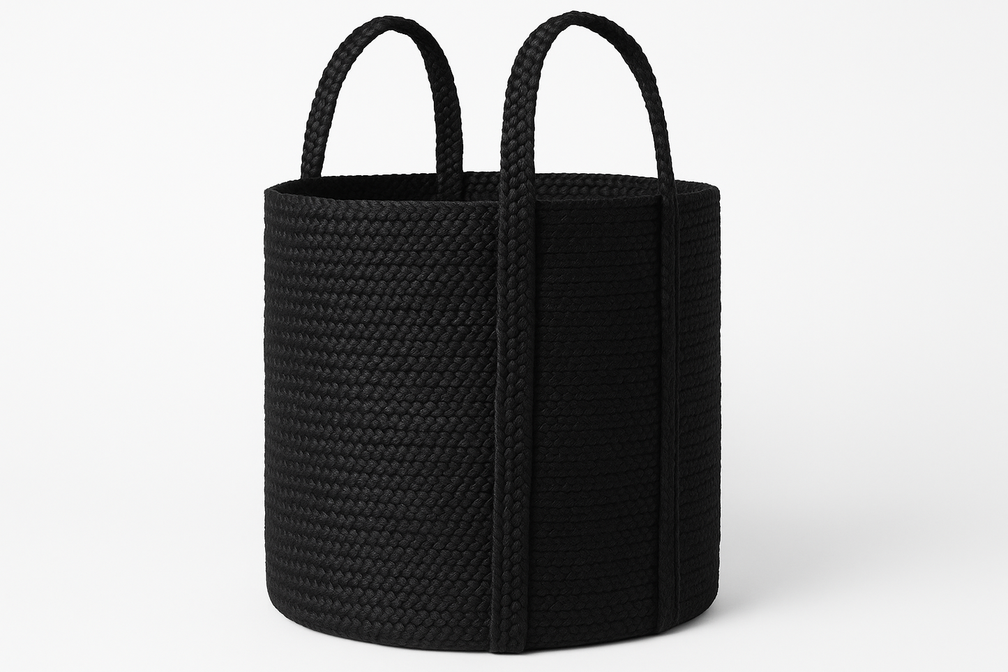 Black woven basket with handles on a white background