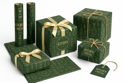Green gift boxes with gold ribbons and 'Kitchen + Metal' branding on a white background
