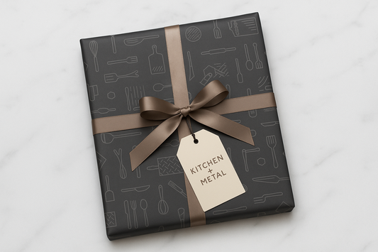 Gift box with 'Kitchen Metal' tag on a light gray background