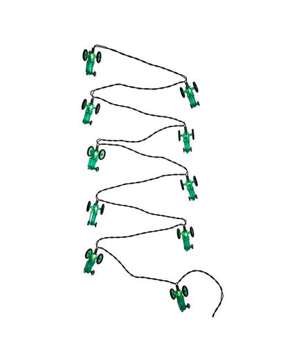 Set of green toy cars on strings arranged in a circular pattern on a white background