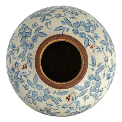 Ceramic vase with blue floral pattern on a white background