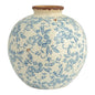 Ceramic vase with blue floral pattern on a white background