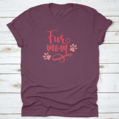 Purple t-shirt with 'Fur mom' text and paw prints on a wooden surface
