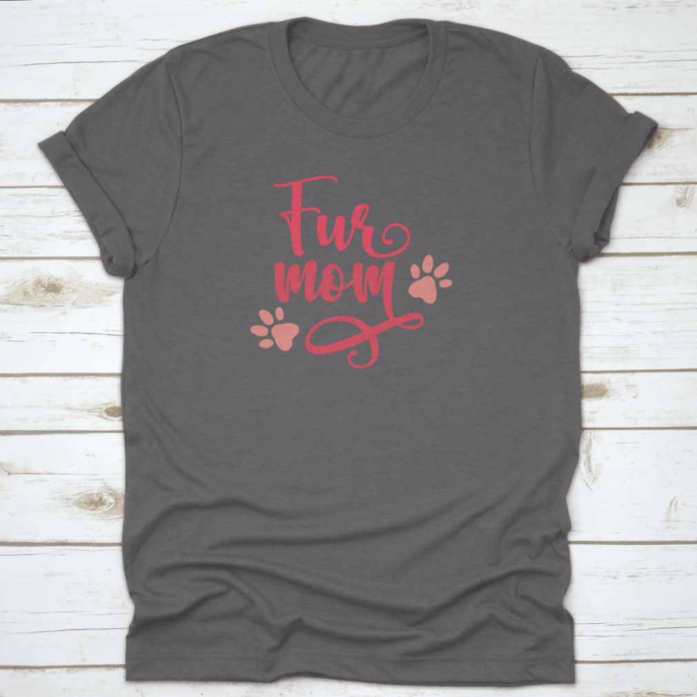 Gray t-shirt with 'Fur Mom' text and paw prints on a wooden surface