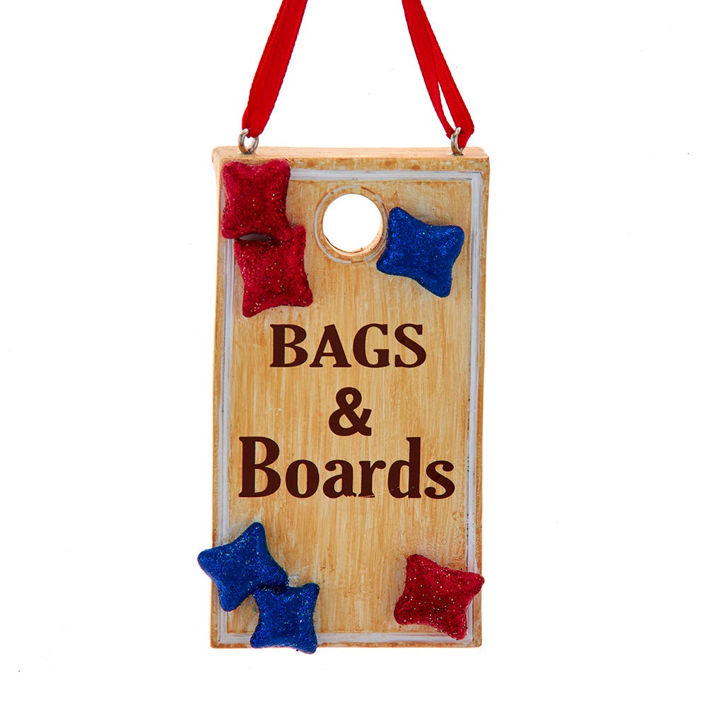 Wooden sign with 'Bags & Boards' text, red and blue stars, and a hole for hanging on a white background.