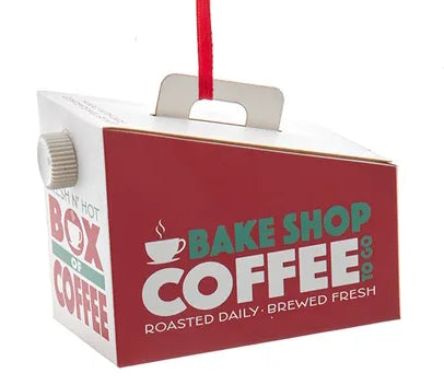 Red and white box of coffee with 'Bake Shop Coffee' branding on a white background