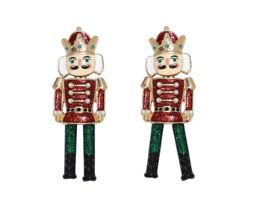 Pair of nutcracker-shaped earrings on a white background