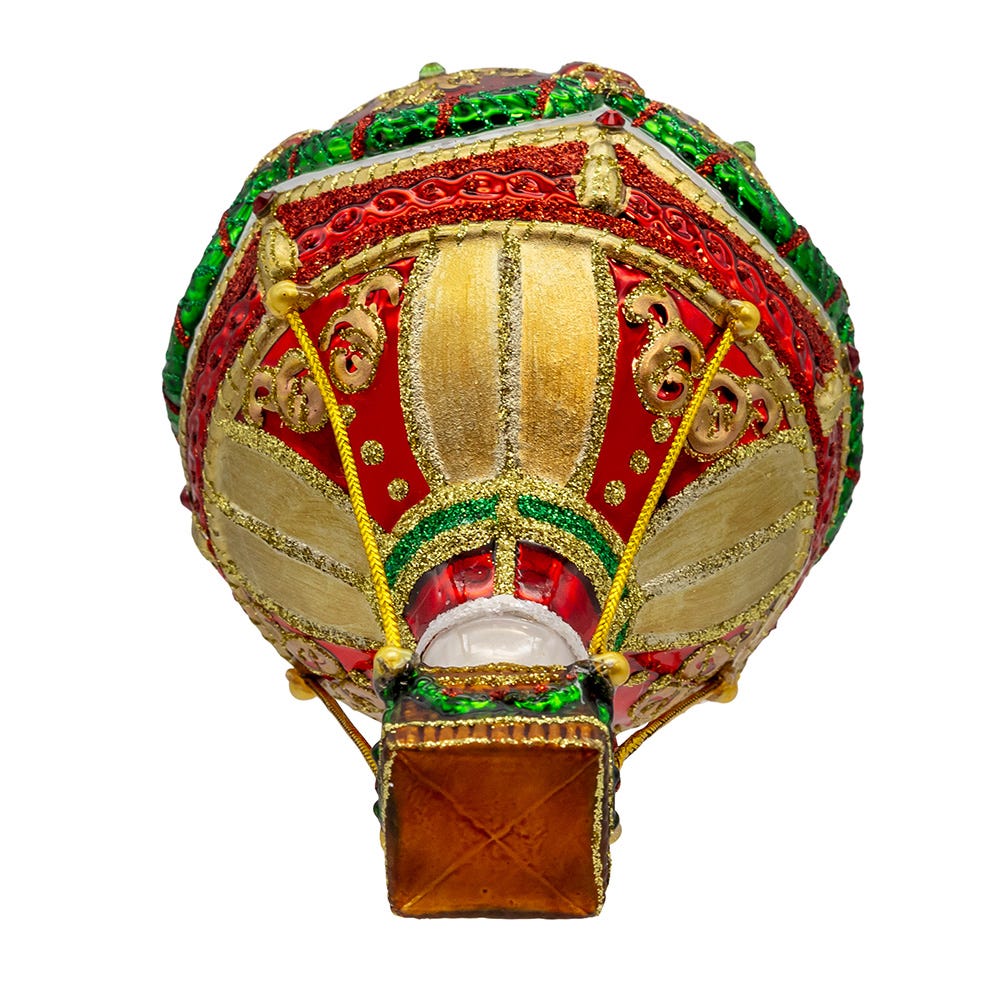 Decorative hot air balloon model with red, gold, and green colors on a white background
