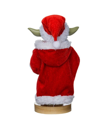 Yoda figurine wearing a Santa Claus outfit on a white background