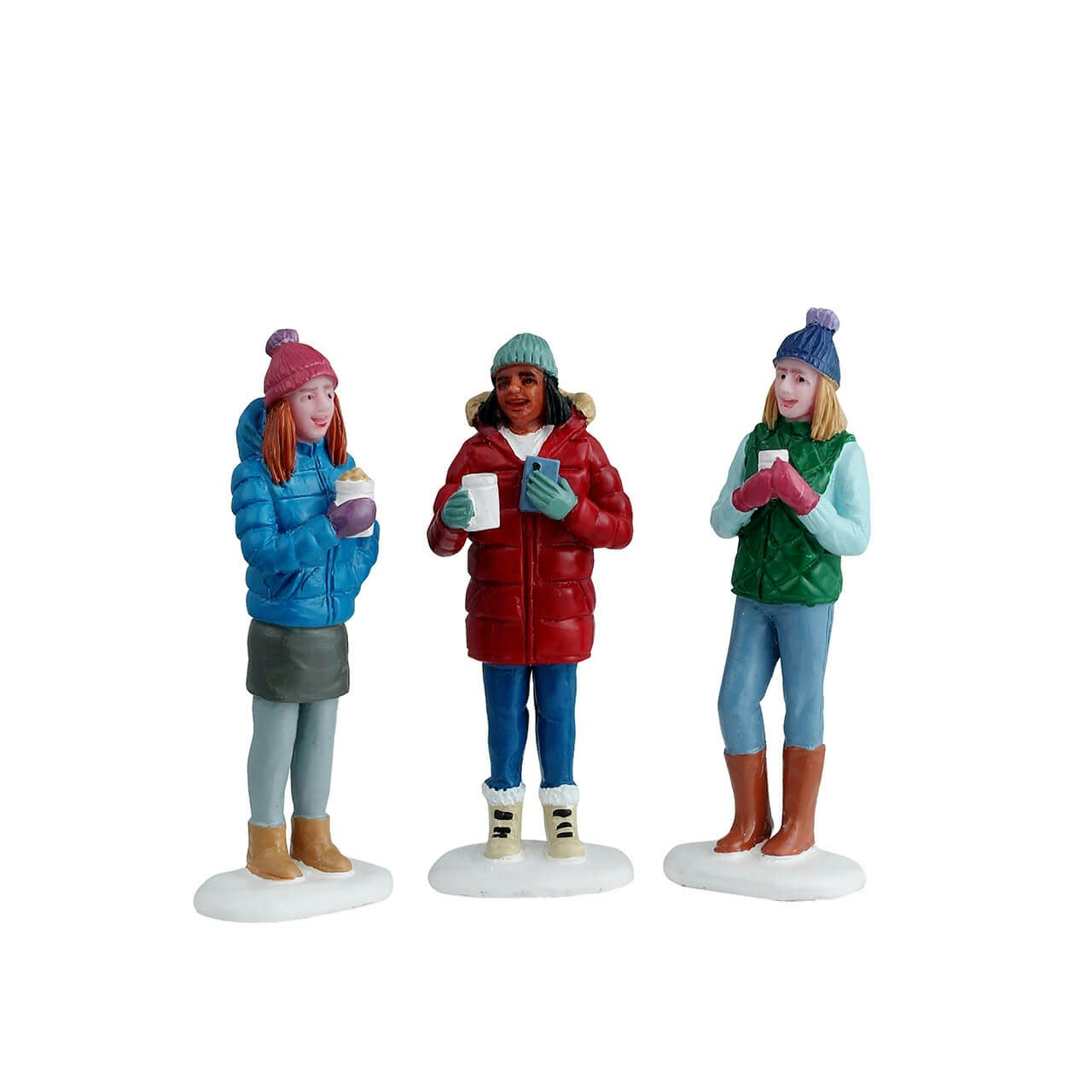 Three figurines of people in winter clothing holding drinks on a white background