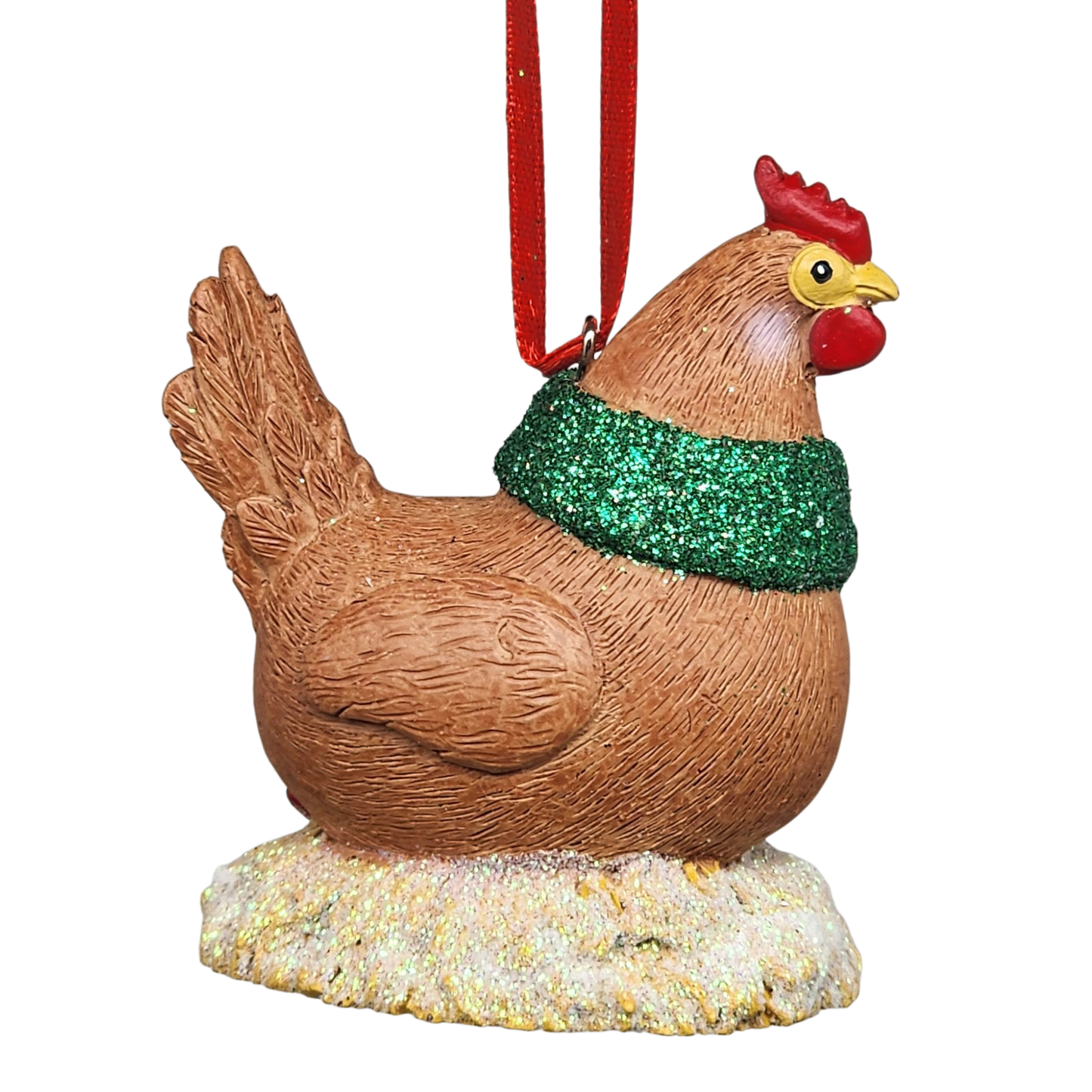Decorative chicken ornament with a green glittery scarf on a white background