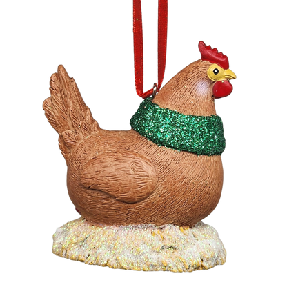 Decorative chicken ornament with a green glittery scarf on a white background