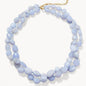 Necklace with light blue beads on a white background