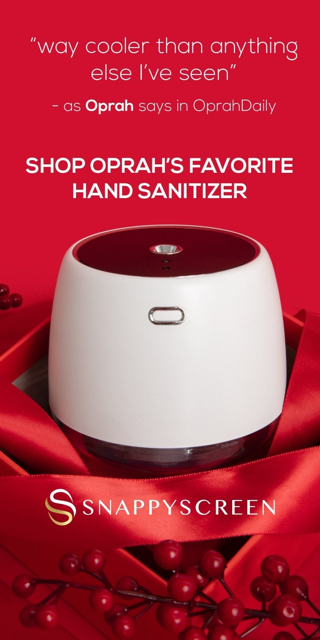 Hand sanitizer dispenser with red ribbon and berries on a red background, featuring Oprah's endorsement.