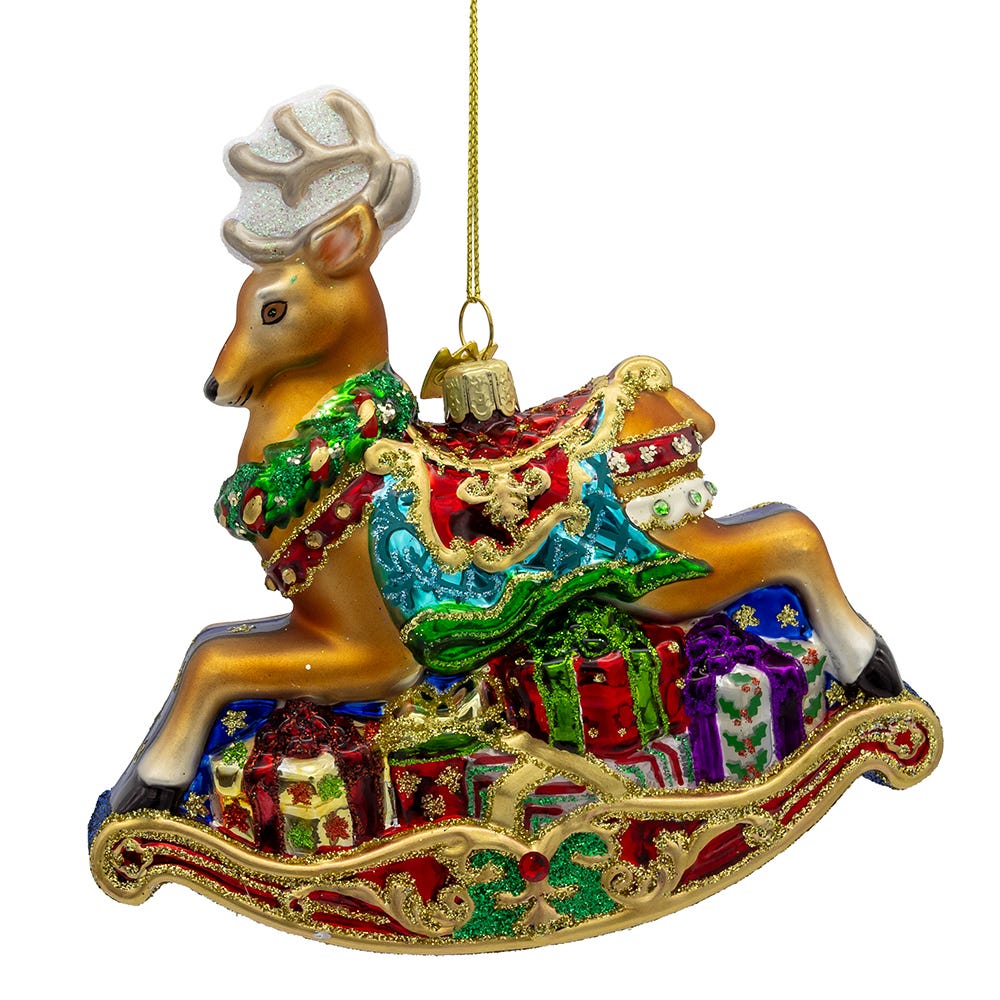 Decorative reindeer ornament with a sleigh full of presents on a white background