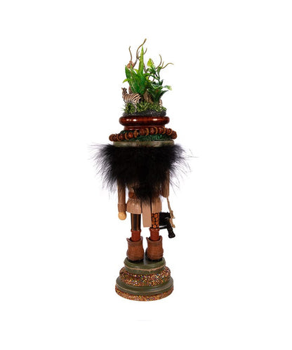 Decorative nutcracker with a natural scene on a white background