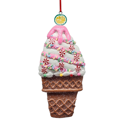 Decorative ice cream cone ornament with pink top and colorful sprinkles on a white background
